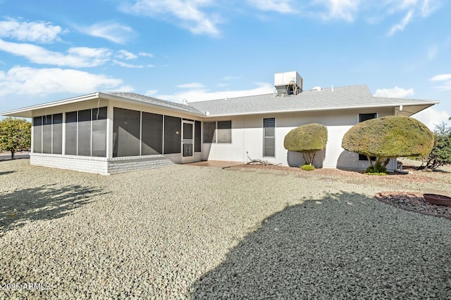 back of house with a sunroom