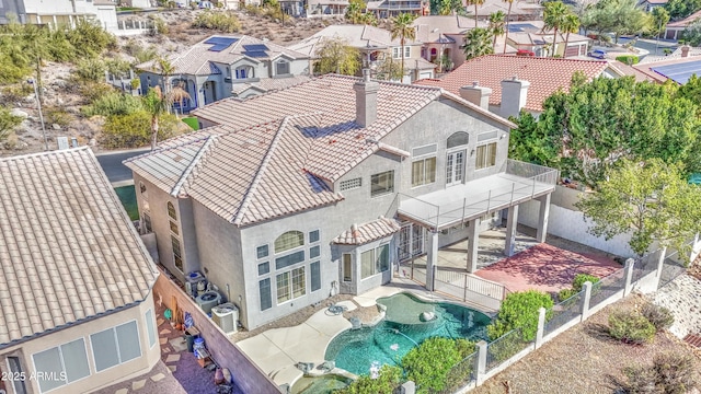 birds eye view of property with a residential view