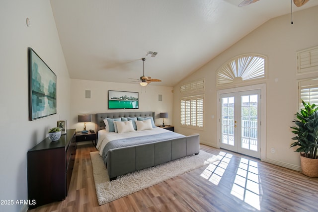 bedroom with visible vents, high vaulted ceiling, a ceiling fan, access to outside, and wood finished floors