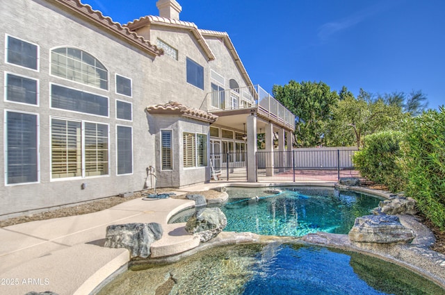 view of swimming pool featuring a fenced in pool, a patio, an in ground hot tub, and fence