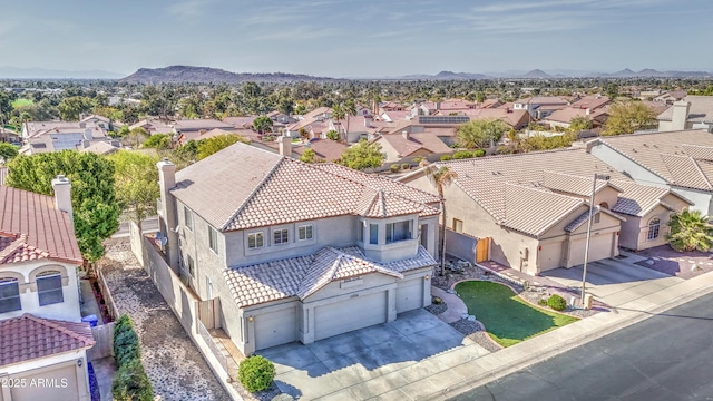 drone / aerial view featuring a mountain view and a residential view