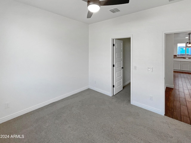 interior space with ceiling fan