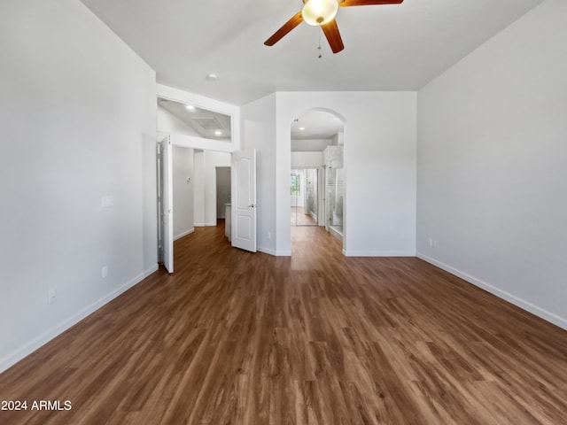 interior space with ceiling fan and dark wood-type flooring