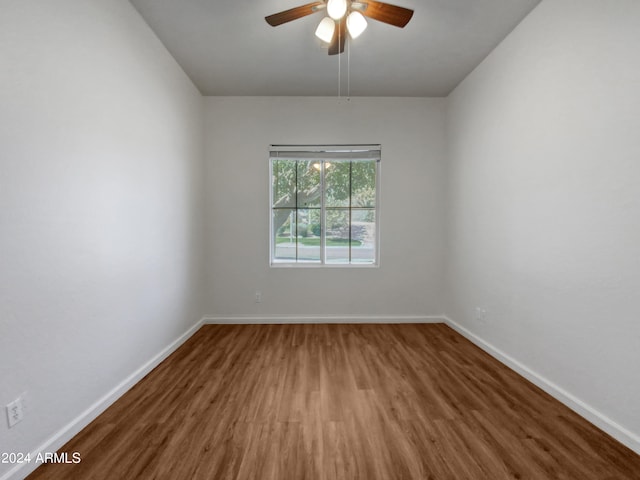 unfurnished room with hardwood / wood-style flooring and ceiling fan