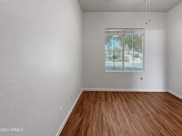 spare room featuring hardwood / wood-style flooring