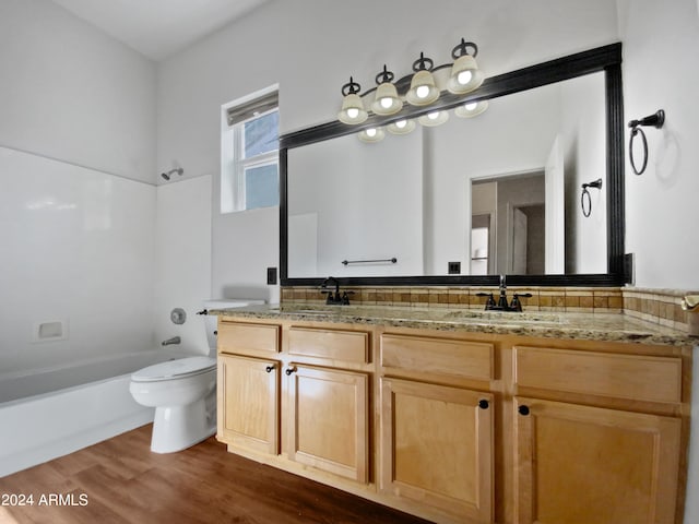 full bathroom featuring shower / tub combination, hardwood / wood-style floors, vanity, and toilet