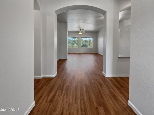 corridor with dark hardwood / wood-style floors