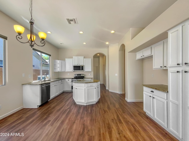 kitchen with white cabinetry, dark wood-type flooring, stainless steel appliances, and sink