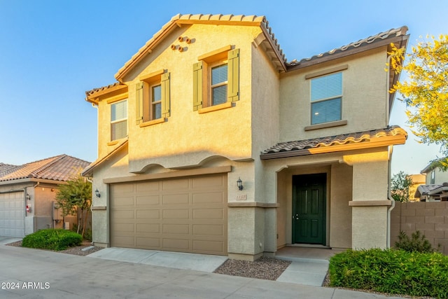 mediterranean / spanish-style house featuring a garage