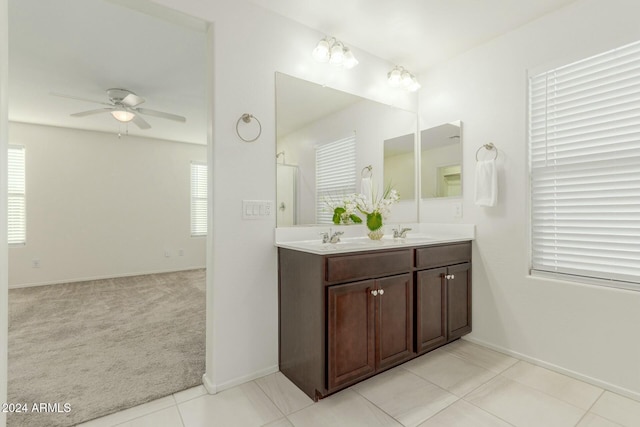 bathroom featuring tile patterned flooring, vanity, and ceiling fan