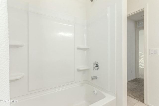 bathroom featuring tile patterned floors and shower / bath combination with curtain