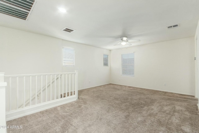 unfurnished room with carpet floors and ceiling fan