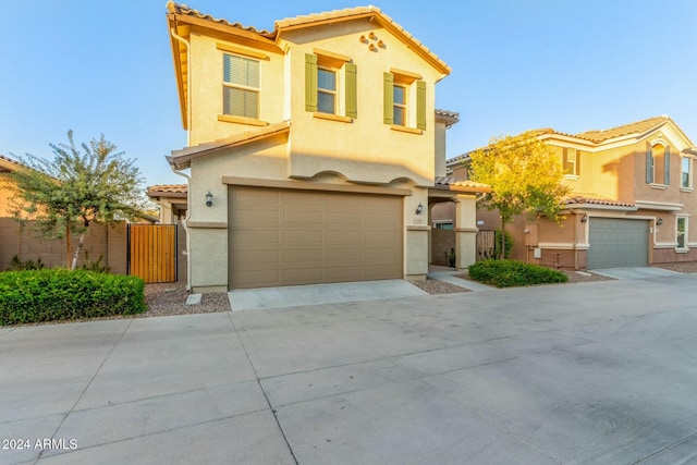 mediterranean / spanish-style house featuring a garage