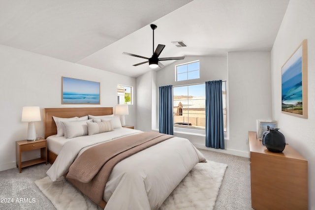 bedroom featuring ceiling fan, light carpet, and lofted ceiling