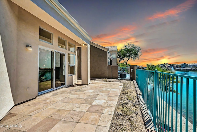 view of patio terrace at dusk