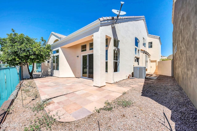 back of property with a patio and cooling unit