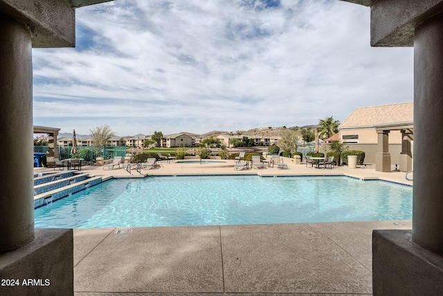 view of swimming pool with a patio area