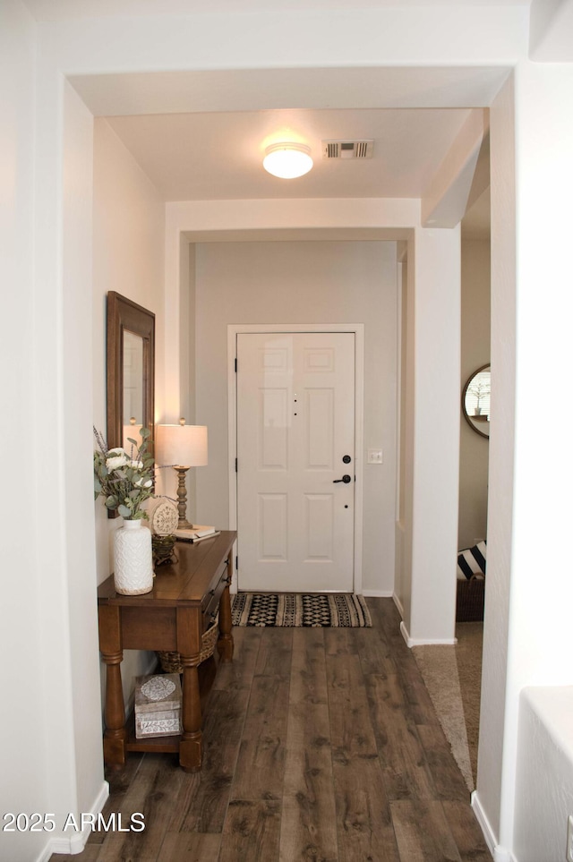 doorway featuring dark hardwood / wood-style flooring