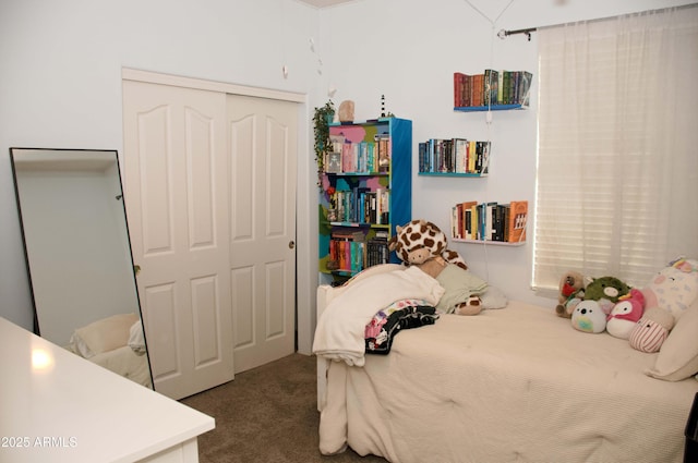 bedroom featuring carpet and a closet