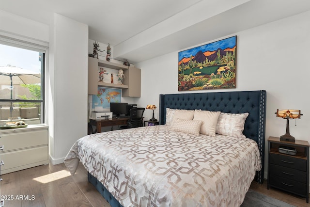 bedroom featuring wood finished floors