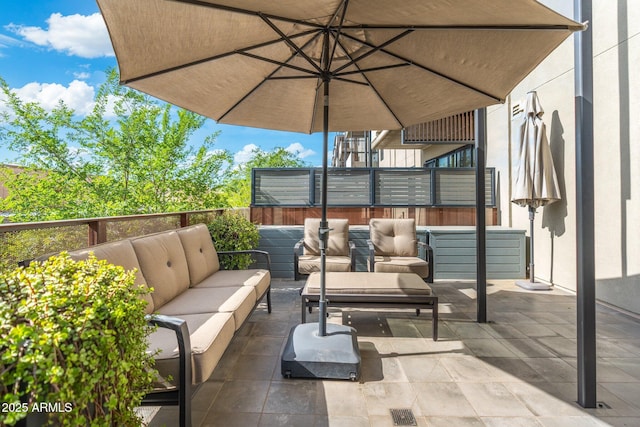 view of patio featuring an outdoor hangout area and fence