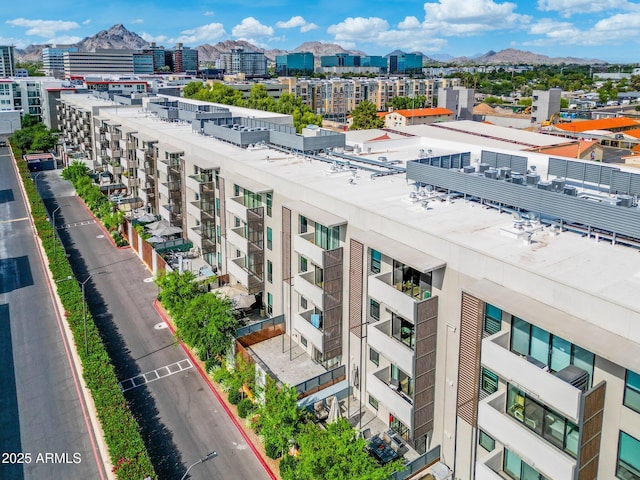 birds eye view of property featuring a view of city and a mountain view