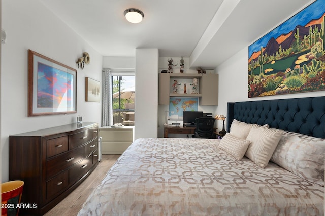 bedroom featuring light wood-type flooring