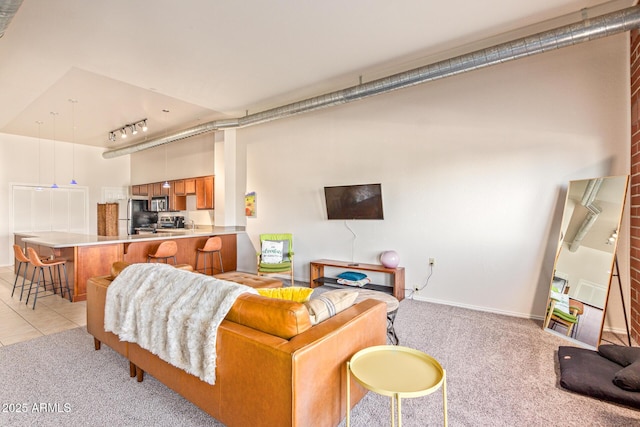 424 S 2nd St Unit 203, Phoenix, AZ 85004 - living room featuring light colored carpet, track lighting, and light tile patterned floors