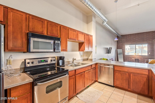 424 S 2nd St Unit 203, Phoenix, AZ 85004 - kitchen featuring appliances with stainless steel finishes, brick wall, light tile patterned flooring, light countertops, and decorative light fixtures