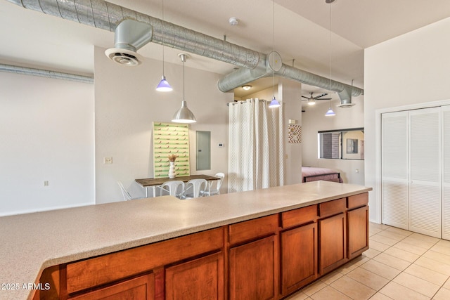 424 S 2nd St Unit 203, Phoenix, AZ 85004 - kitchen featuring brown cabinets, light tile patterned floors, decorative light fixtures, light countertops, and ceiling fan