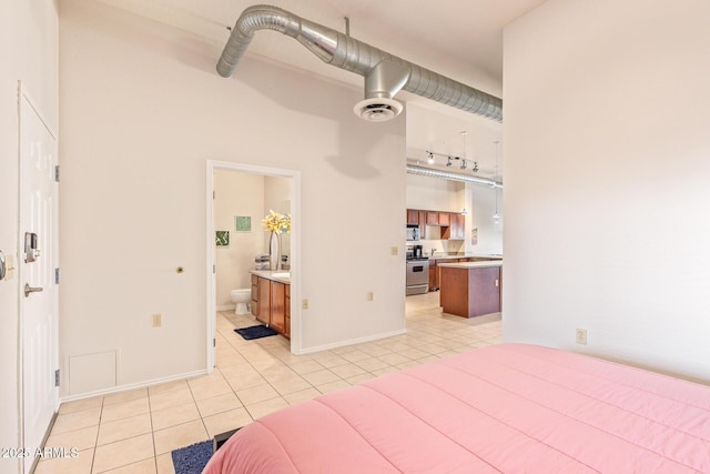 424 S 2nd St Unit 203, Phoenix, AZ 85004 - bedroom featuring light tile patterned floors and ensuite bathroom