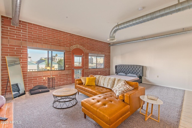 424 S 2nd St Unit 203, Phoenix, AZ 85004 - carpeted living room featuring brick wall