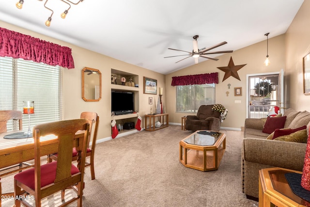 living room featuring carpet flooring, ceiling fan, lofted ceiling, and built in shelves