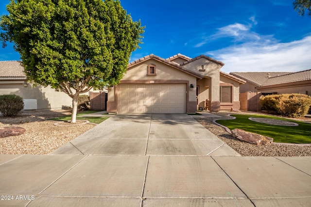 view of front of property with a garage