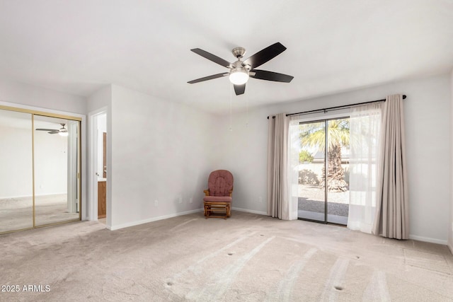 unfurnished room with ceiling fan and light colored carpet