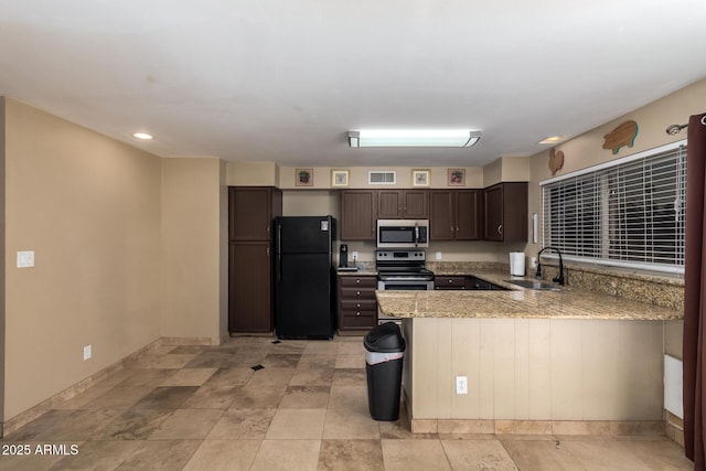 kitchen with sink, a breakfast bar area, kitchen peninsula, stainless steel appliances, and dark brown cabinets