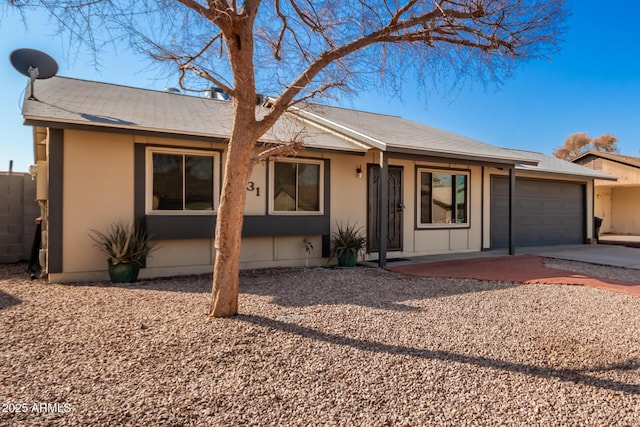 ranch-style home with a garage