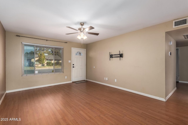 spare room featuring ceiling fan and hardwood / wood-style floors