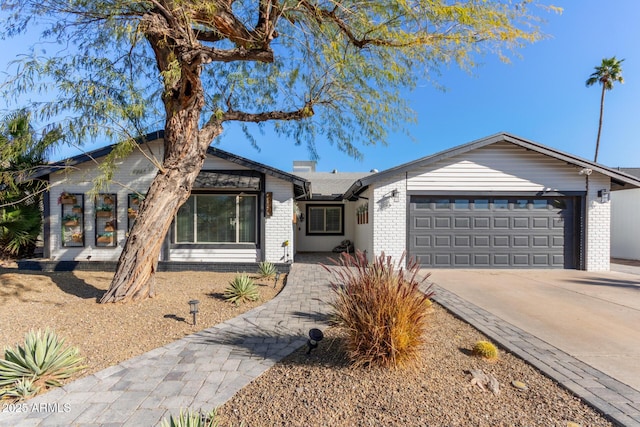 single story home featuring a garage