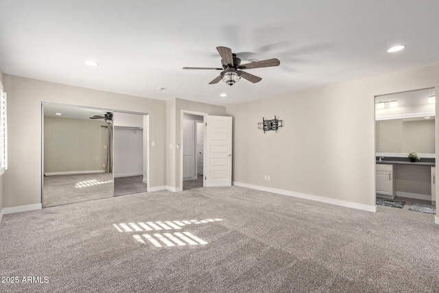 unfurnished bedroom with a closet, ceiling fan, and carpet