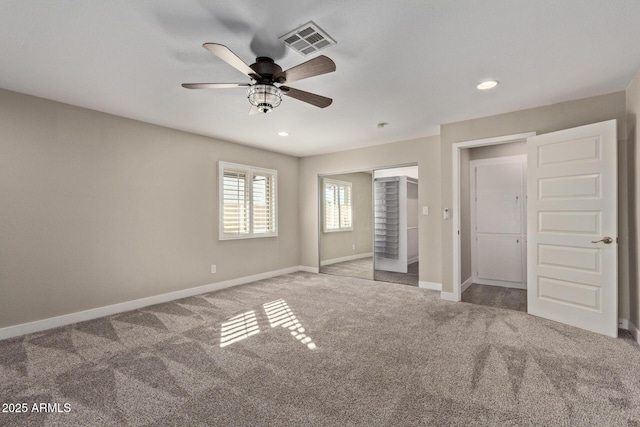 unfurnished bedroom featuring a closet, ceiling fan, and light carpet