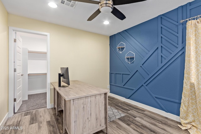 home office featuring hardwood / wood-style flooring and ceiling fan