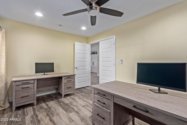 office featuring hardwood / wood-style flooring and ceiling fan