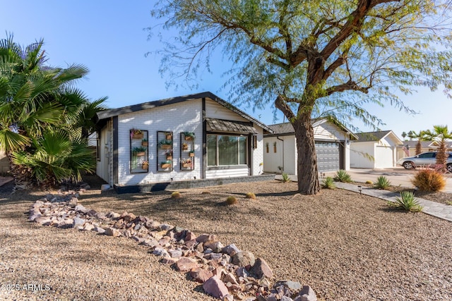 single story home with a garage