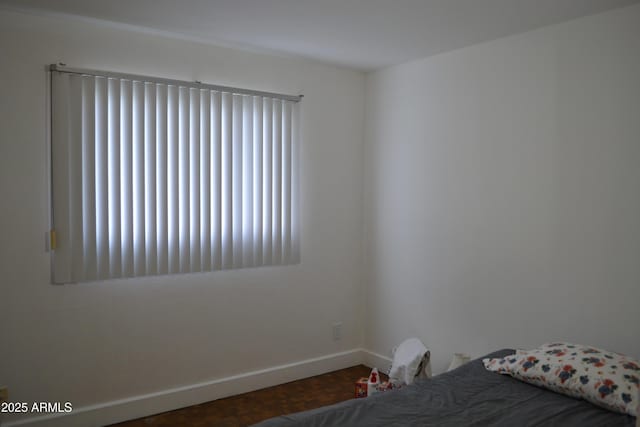 unfurnished bedroom featuring baseboards