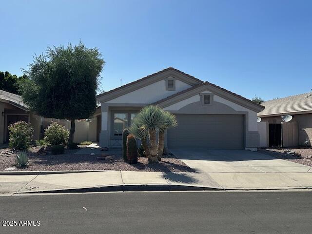 21192 N 80th Ln, Peoria, AZ 85382 - single story home featuring a garage, driveway, and stucco siding