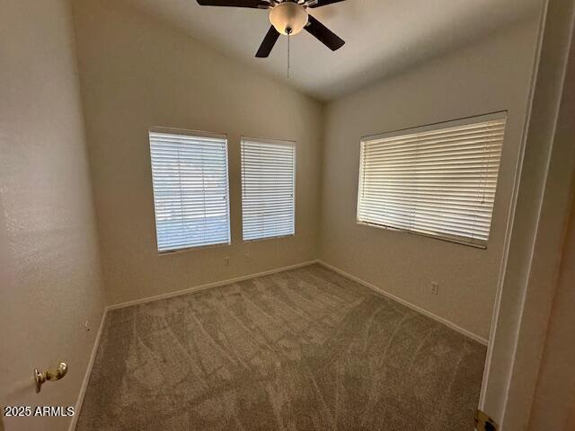 21192 N 80th Ln, Peoria, AZ 85382 - unfurnished room with vaulted ceiling, baseboards, carpet flooring, healthy amount of natural light, and ceiling fan