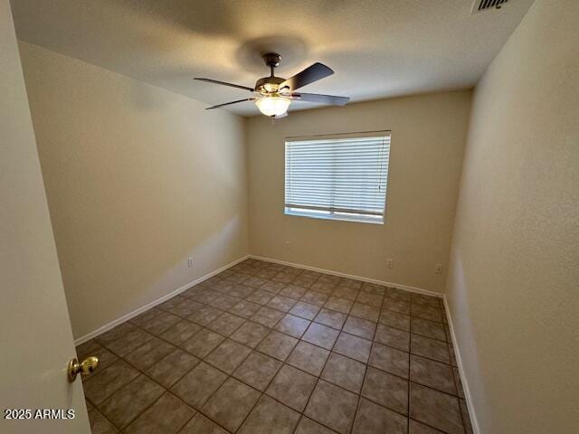 21192 N 80th Ln, Peoria, AZ 85382 - tiled empty room with a ceiling fan and baseboards
