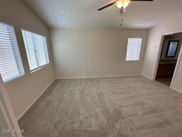 21192 N 80th Ln, Peoria, AZ 85382 - unfurnished room with a ceiling fan, carpet, and baseboards
