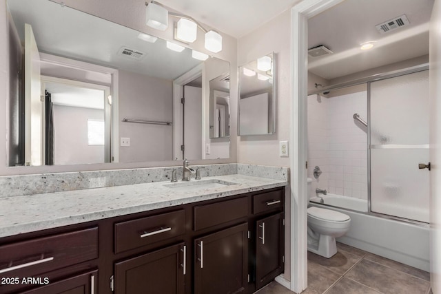 full bathroom with visible vents, toilet, and combined bath / shower with glass door